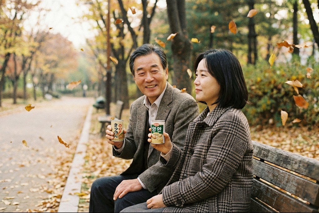 The couple sitting on a park bench, looking at autumn leaves with a peaceful expression.
